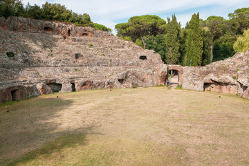 arena of the Roman amphitheatre excavated in the tuff rock in Sutri, province of Viterbo, Lazio, Italy