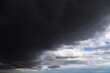 Epic Dramatic storm sky with dark grey black rain clouds on blue sky background, thunderstorm, hurricane, tornado