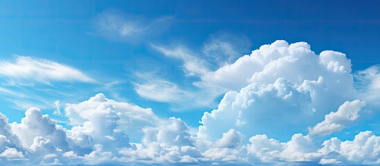 Poster - background, the sky exhibited the marvels of nature a splendid canvas of light and white clouds, enhancing the beauty of the blue expanse on a beautiful, bright and cloudy day, as the air felt