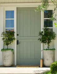 Wall Mural - cottage with sage green Dutch door and citrus topiaries