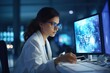 Young woman scientist with computer in lab, analyzing data, white coat, medical technology, team of experts, research.