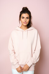 Fashionable young beautiful stylish woman in a hoodie mockup. Fashion, clothing blank hoodie.
