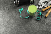 Tasty Shake, Sports Equipment And Measuring Tape On Stone Table, Above View With Space For Text. Weight Loss