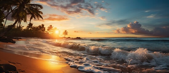 Canvas Print - As the sun sets beautiful summer sky, casting a golden glow upon the landscape, the gentle waves of the blue ocean crash against the sandy beach, creating a serene and picturesque scene for travelers