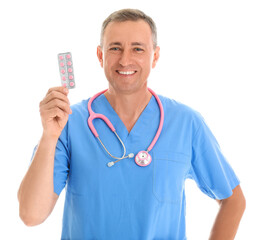 Sticker - Mature doctor with pills on white background