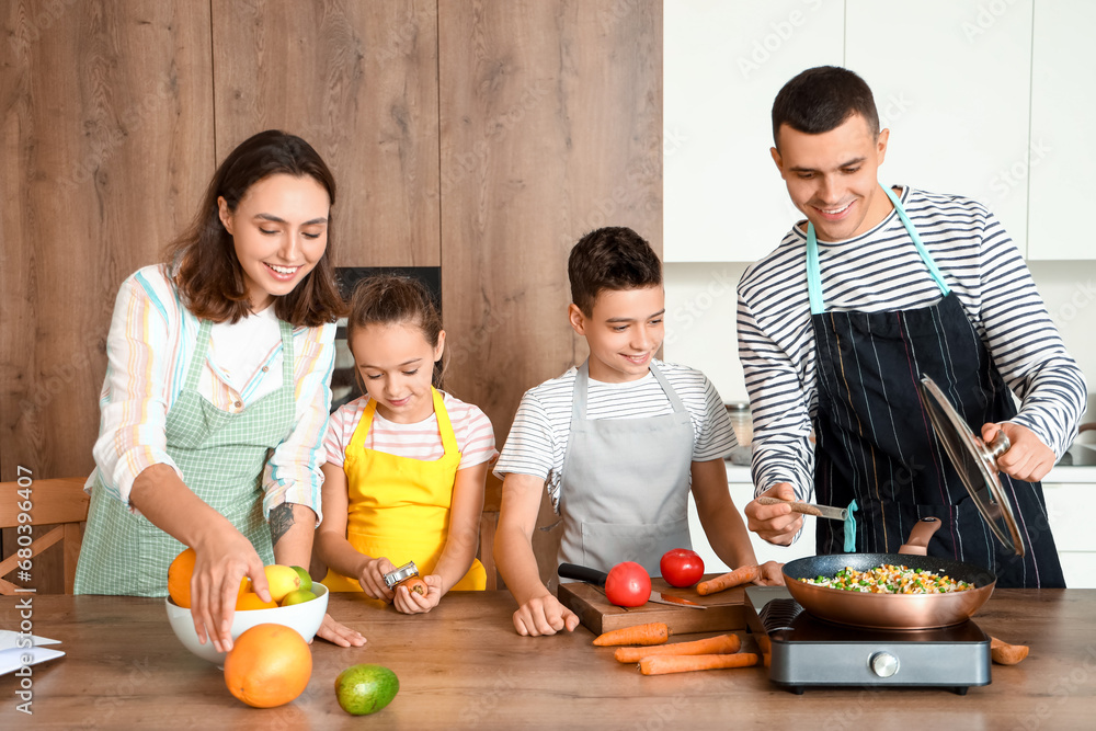 Happy family cooking in kitchen