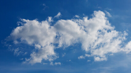 Wall Mural - Blue sky background with tiny clouds. Cloudscape - Blue sky and white clouds. Clouds with blue sky