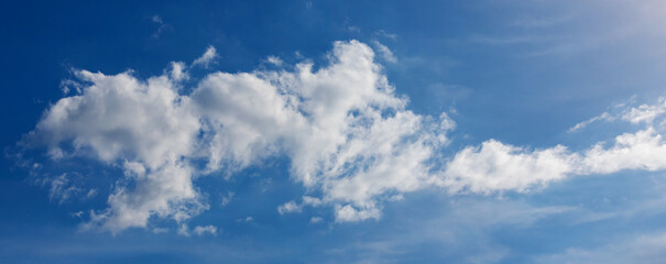 Wall Mural - Blue sky background with tiny clouds. Cloudscape - Blue sky and white clouds. Clouds with blue sky