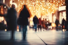 Blurred Defocused Image Background, City Street Decorated For Christmas Time. People Walking In Street, Buying Presents, Preparing For Holidays.