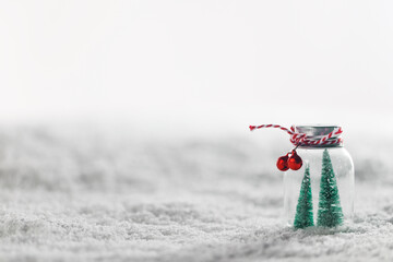 Wall Mural - Christmas ornaments on snow