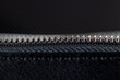 zipper on a black women's handbag close-up