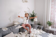 © Aleksandr - Adorable little girl make a mess at home. Five year old girl throws napkins in living room
