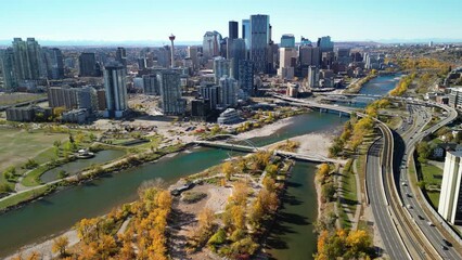 Wall Mural - Downtown Calgary skyline and Bow River in autumn season. Aerial view of City of Calgary, Alberta, Canada.