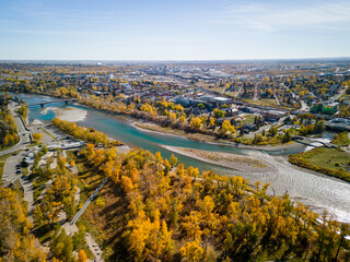 Poster - St. Patrick's Island Park and Bow River aerial view in autumn season. Fall foliage in City of Calgary, Alberta, Canada.