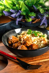 Poster - Meatballs pork and mashed potatoein paprika gravy served with groats bulgur.