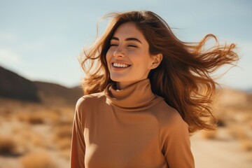 Wall Mural - Portrait of a blissful woman in her 30s wearing a classic turtleneck sweater against a backdrop of desert dunes. AI Generation