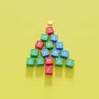 Christmas Tree Symbol made by color Computer keys cap on yellow background. Minimal Christmas idea concept flat lay. 3D Rendering
