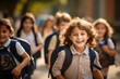 Boy with long hair moving and with happy face when he arrives at school. Group of students with backpacks on their backs excited at the entrance to the school. AI generated