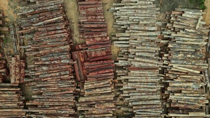 Poster - Aerial drone footage: Zooming out on a timber stack of a sustainable forestry project in the brazilian Amazon rainforest