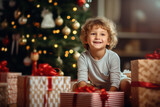 Fototapeta Na ścianę - Small cute Happy child smile opening Christmas presents, gift box with red ribbon, giving receiving presents Xmas with Christmas tree bokeh