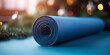 a rolled-up neoprene sports mat on a  background,Yoga outdoor concept of health and body care, Blue yoga mat . equipment for yoga. concept healthy lifestyle and sport with generative ai


