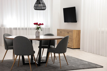 Poster - Stylish dining room interior with table and chairs