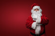 © Fxquadro - Shot of bearded santa with red winter costume looking at camera.
