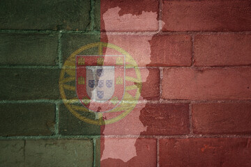Wall Mural - map and flag of portugal on a old brick wall
