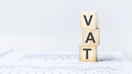 Wall Mural - text VAT on wooden cube blocks stack on wood table on white background with copy space