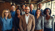Portrait of smiling diverse business people standing in office and looking at camera.