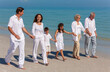 © Darren Baker - Mother, Father, Grandparents and Children Family Walking On Beach