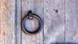 Wooden wall background with antique iron ring