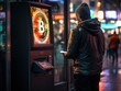 A young man withdraws his bitcoins from the ATM