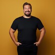 © Vitalii But - Fat man smiling in black t-shirt on yellow background isolated AI