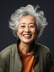 Beautiful portrait of happy old women on blur background