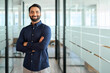 © insta_photos - Happy Indian businessman professional leader standing arms crossed in office. Smiling male employee, business man company executive manager, confident eastern entrepreneur at work, portrait.