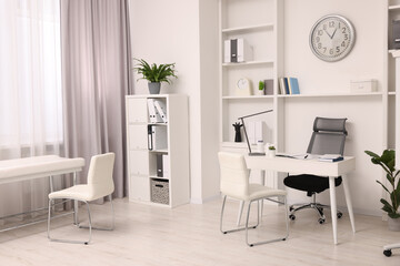 Sticker - Modern medical office interior with doctor's workplace and examination table