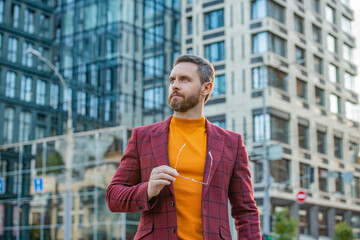 Wall Mural - confident caucasian guy style outdoor. caucasian guy style in the street.