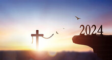 2024 Freedom Concept, Silhouette Of Christian Cross With 2024 Years At Sunset Background