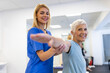 Patient stretching, physiotherapist woman and physical therapy help for muscle or arthritis exercise in consulting exam. Physiotherapy, chiropractor and healthcare rehabilitation support of woman
