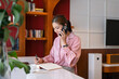 © PIC SNIPE - Businesswoman talking on the phone at home.