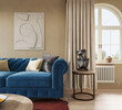 © Василь Чейпеш - Contemporary home apartment with blue Manchester sofa in cozy living room interior. Wall mockup, 3d rendering