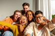 © Богдан Маліцький - multiracial group of young friends smiling and taking selfies for the camera, asian, african american and european