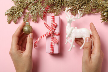 Wall Mural - Gifts with Christmas decorations on a pink background