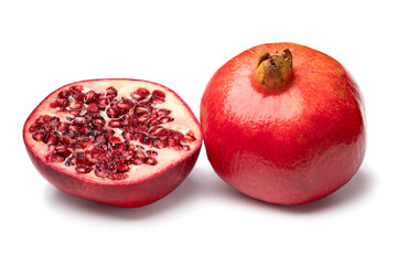 Wall Mural - Whole and halved red ripe pomegranate isolated  on white background close up