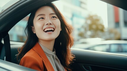 Wall Mural - Young beautiful asian women getting new car. she very happy and excited looking outside 