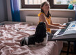Girl child with a dog. A girl plays the piano with her little Shih Tzu dog.