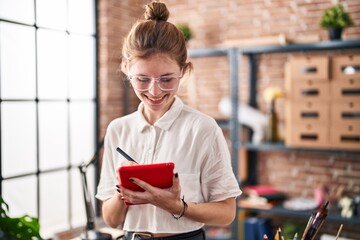 Sticker - Young blonde woman artist smiling confident drawing on touchpad at art studio