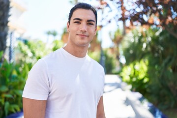 Sticker - Young hispanic man smiling confident standing at park