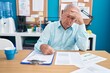 © Krakenimages.com - Middle age grey-haired man business worker stressed working at office